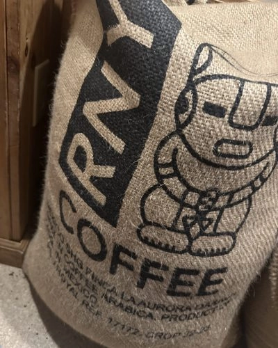 A large burlap sack of Mexican coffee beans